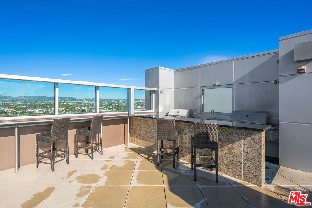 13700 Marina Pointe Drive, Unit 1007 Marina del Rey, CA 90292 - Photo 32 of 53 a room with a table chairs and entryway