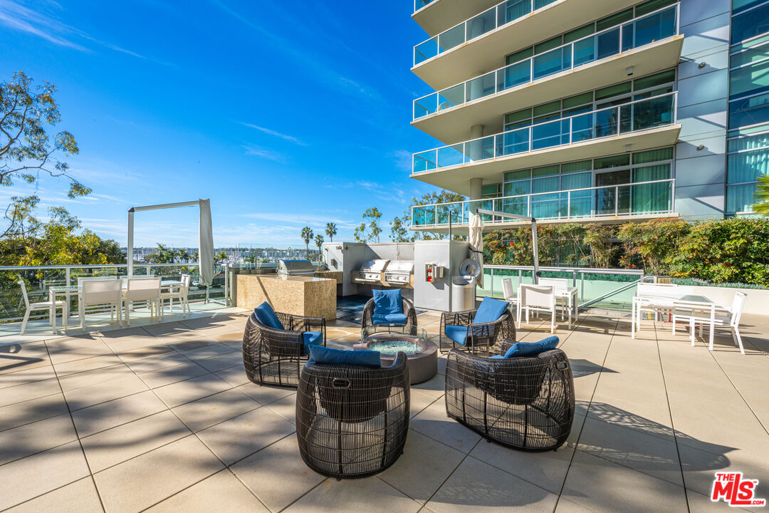 13700 Marina Pointe Drive, Unit 1007 Marina del Rey, CA 90292 - Photo 38 of 53 a view of a patio with couches and potted plants
