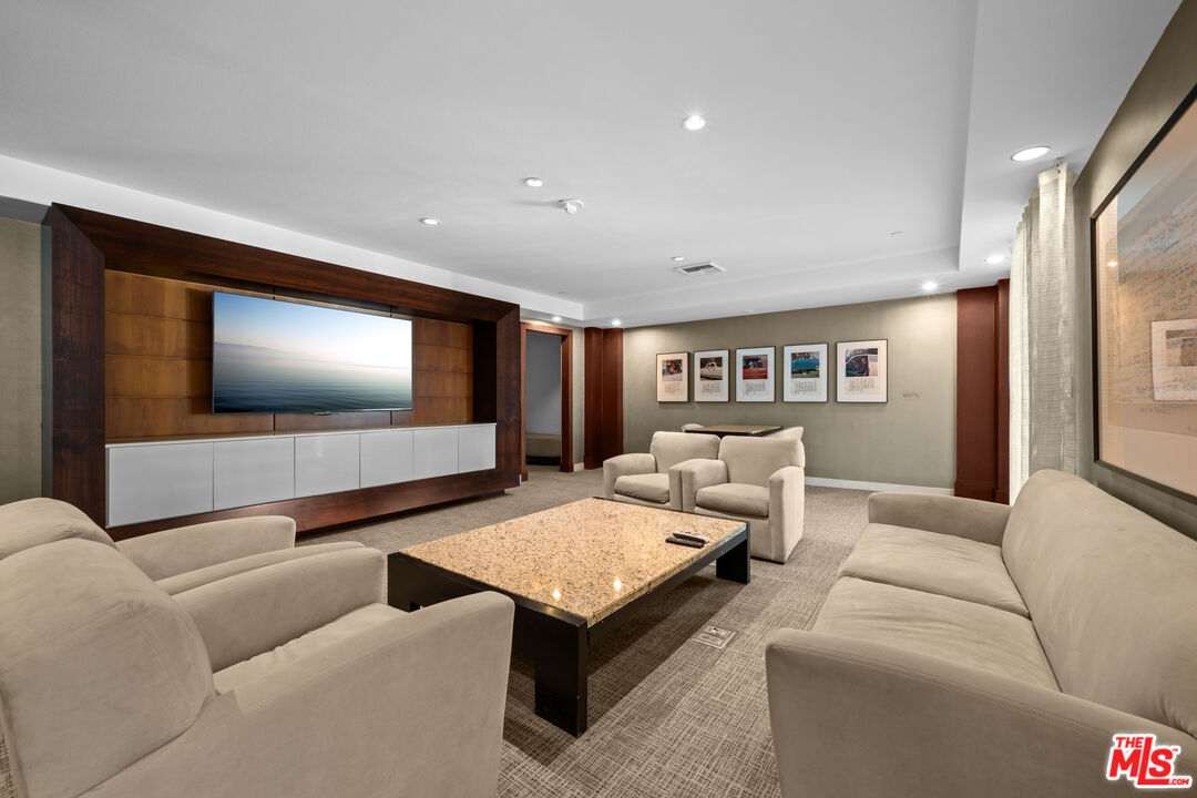 13700 Marina Pointe Drive, Unit 1007 Marina del Rey, CA 90292 - Photo 43 of 53 a living room with furniture and a flat screen tv