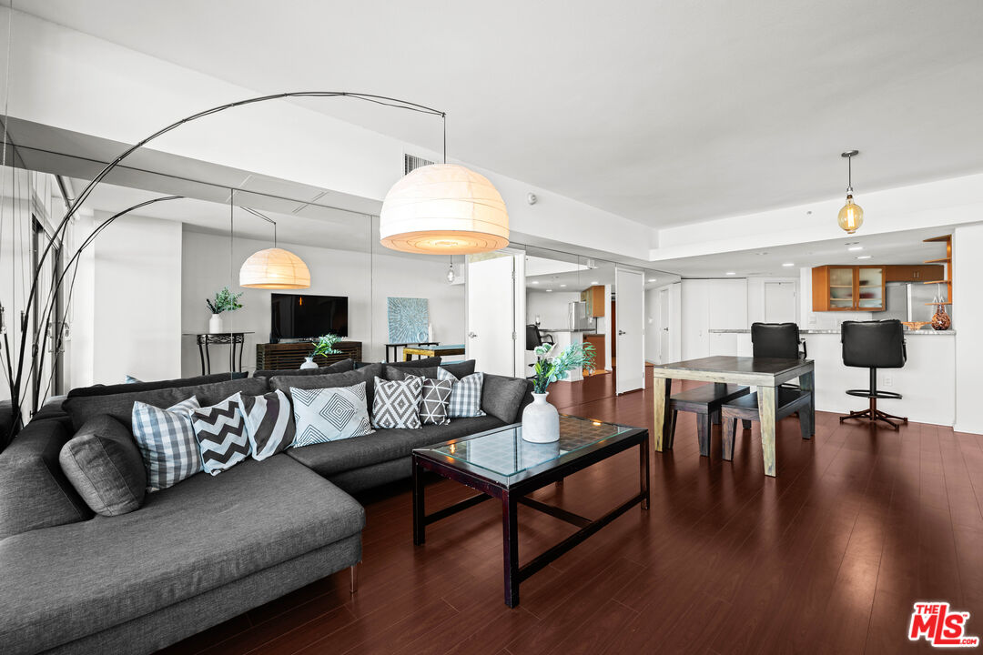 13700 Marina Pointe Drive, Unit 1007 Marina del Rey, CA 90292 - Photo 8 of 53 a living room with furniture fireplace and a table