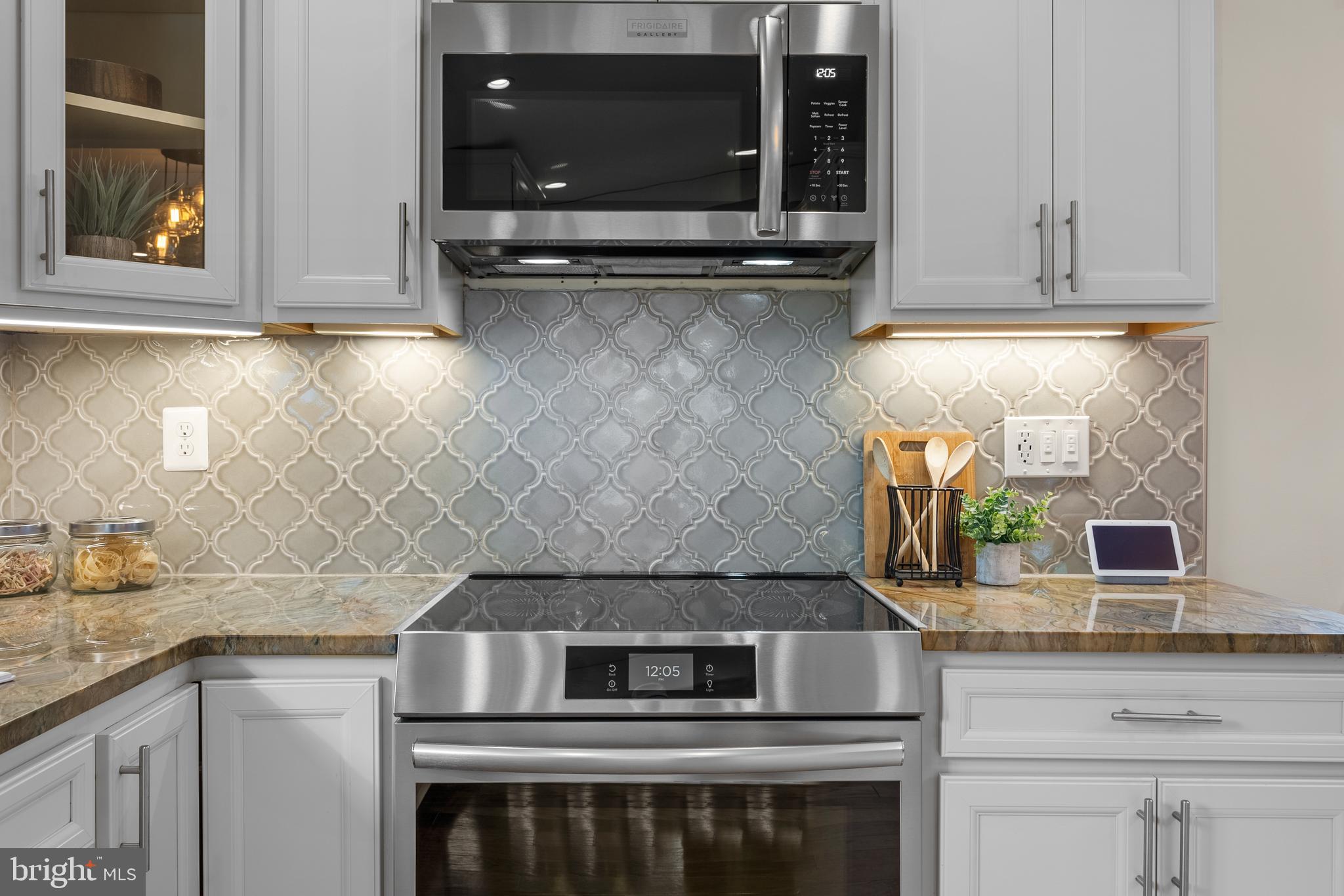 5 Webb Road Cabin John, MD 20818 - Photo 12 of 46 a kitchen with granite countertop a stove and a sink