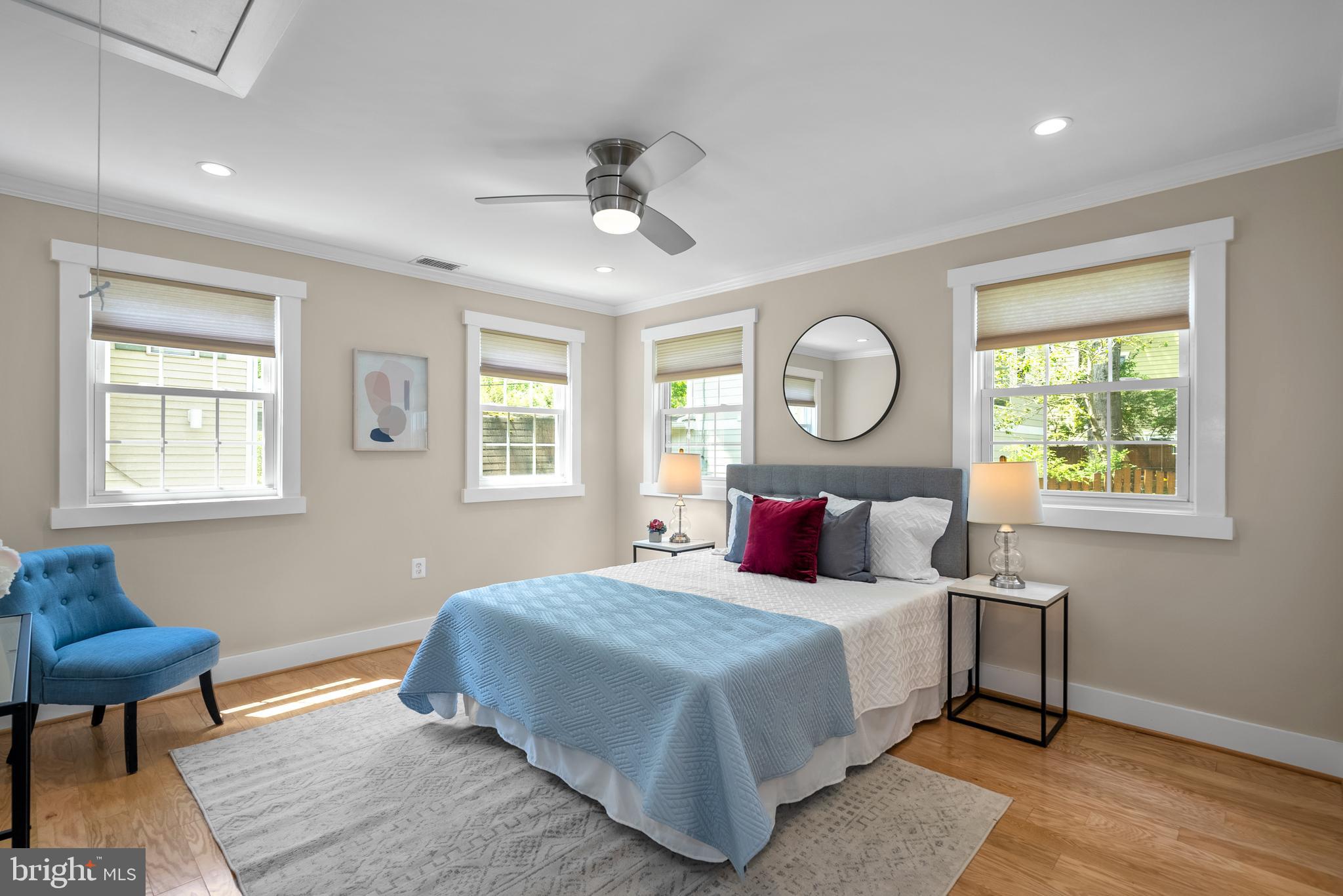 5 Webb Road Cabin John, MD 20818 - Photo 17 of 46 a bedroom with a bed a mirror and a window