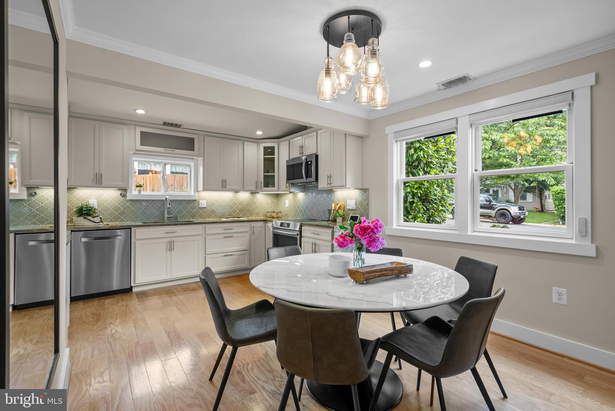 5 Webb Road Cabin John, MD 20818 - Photo 9 of 46 a kitchen with kitchen island a dining table and chairs