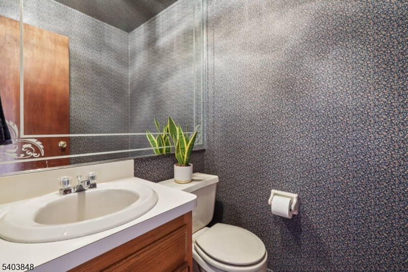 70 River Road, Unit C3 Clifton, NJ 07014 - Photo 17 of 35 a bathroom with a sink toilet and mirror