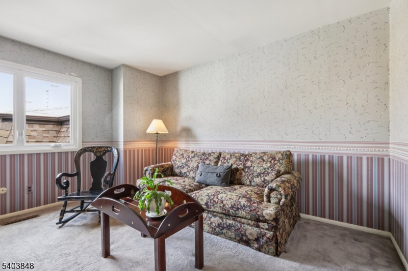 70 River Road, Unit C3 Clifton, NJ 07014 - Photo 20 of 35 a living room with furniture and a window