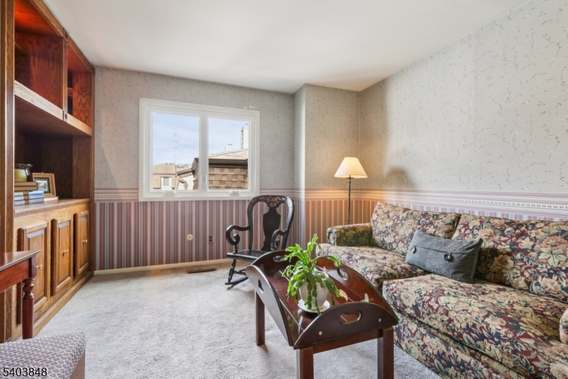 70 River Road, Unit C3 Clifton, NJ 07014 - Photo 21 of 35 a living room with furniture and a window