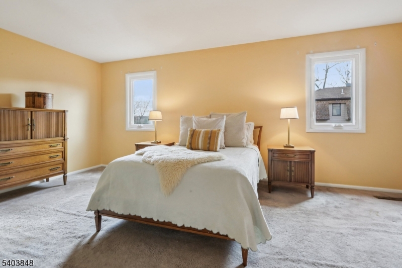 70 River Road, Unit C3 Clifton, NJ 07014 - Photo 24 of 35 a bedroom with a bed and wooden floor