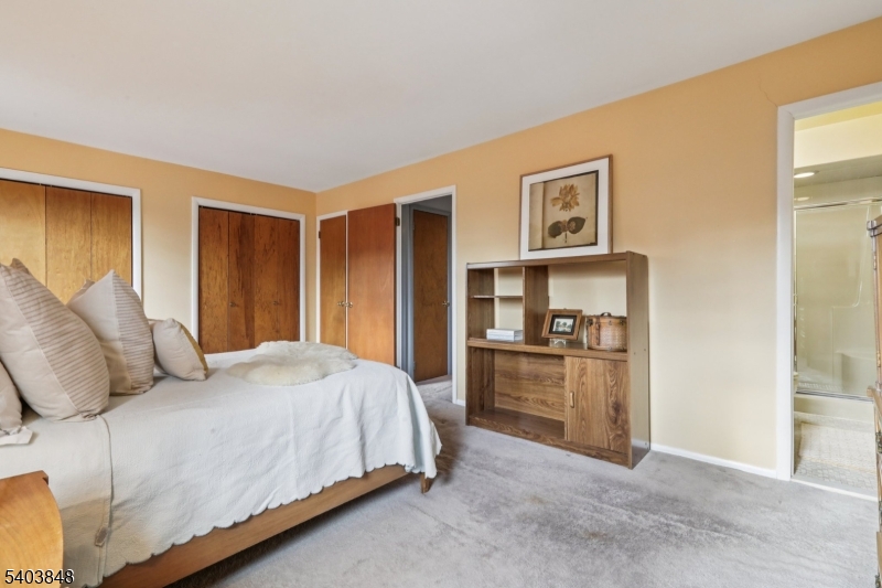 70 River Road, Unit C3 Clifton, NJ 07014 - Photo 27 of 35 a bedroom with a bed and a cabinets