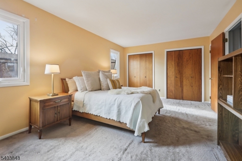 70 River Road, Unit C3 Clifton, NJ 07014 - Photo 28 of 35 a bedroom with a bed and a cabinets