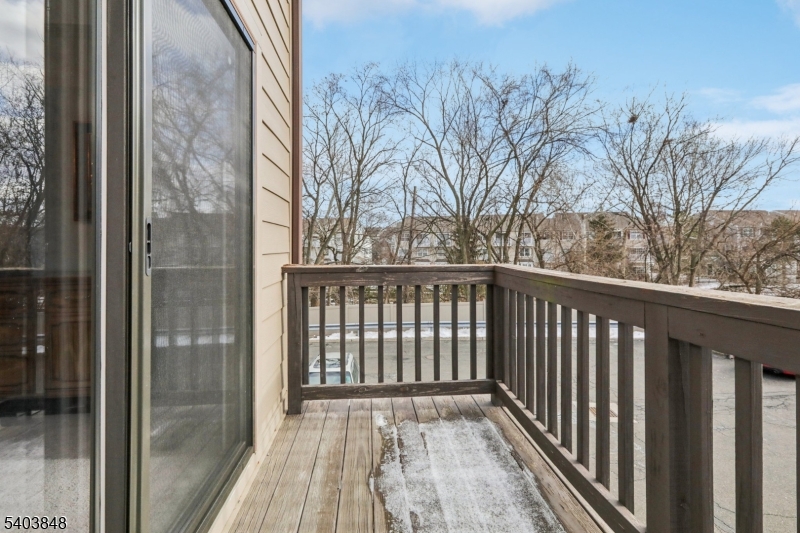 70 River Road, Unit C3 Clifton, NJ 07014 - Photo 32 of 35 a view of a balcony with wooden floor and fence