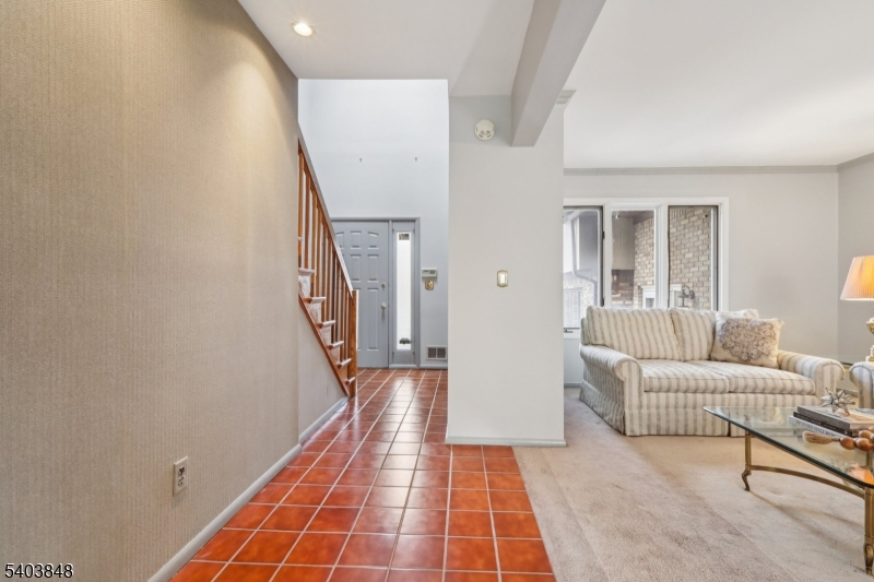 70 River Road, Unit C3 Clifton, NJ 07014 - Photo 5 of 35 a hallway with furniture and a rug