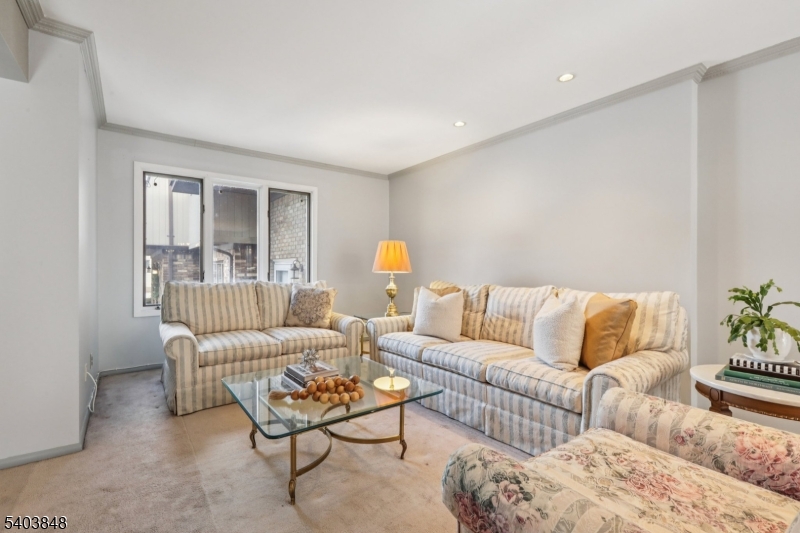 70 River Road, Unit C3 Clifton, NJ 07014 - Photo 6 of 35 a living room with furniture and a window