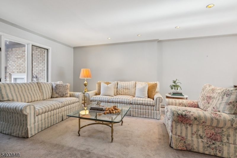 70 River Road, Unit C3 Clifton, NJ 07014 - Photo 7 of 35 a living room with furniture and a couch