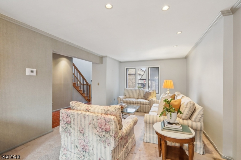 70 River Road, Unit C3 Clifton, NJ 07014 - Photo 9 of 35 a living room with furniture and a wooden floor