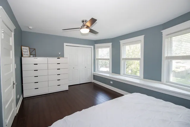 a view of a bedroom with windows