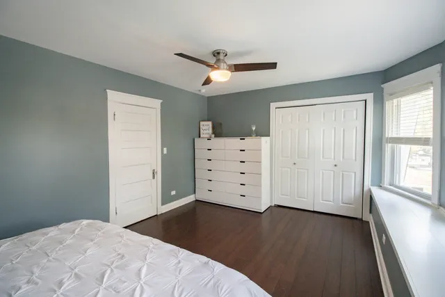 a bed room with a bed and a window