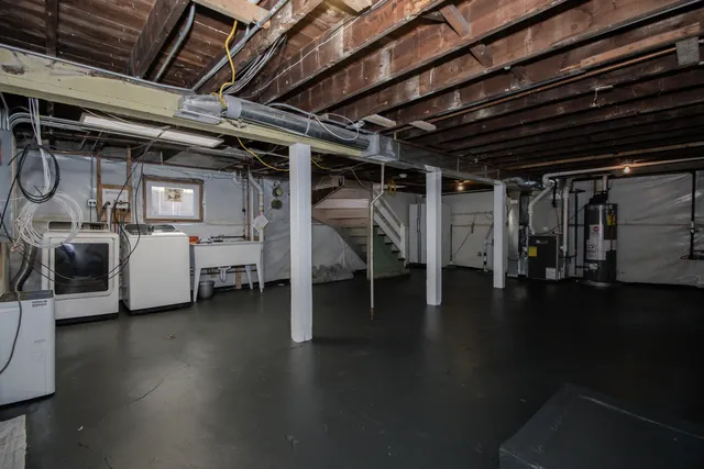 a view of a room with lot of shelves and wooden floors