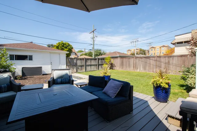 a outdoor living space with furniture and a fireplace