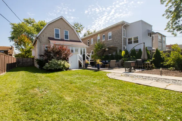a view of house with yard and outdoor space