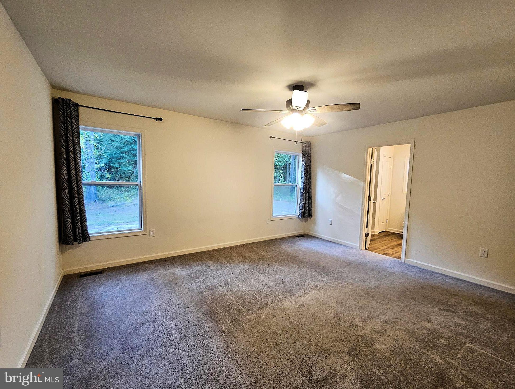 26300 Fire Tower Road Seaford, DE 19973 - Photo 18 of 52 an empty room with windows and closet