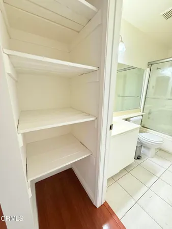 a view of parking garage with cars