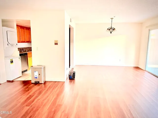 a kitchen with a refrigerator and cabinets