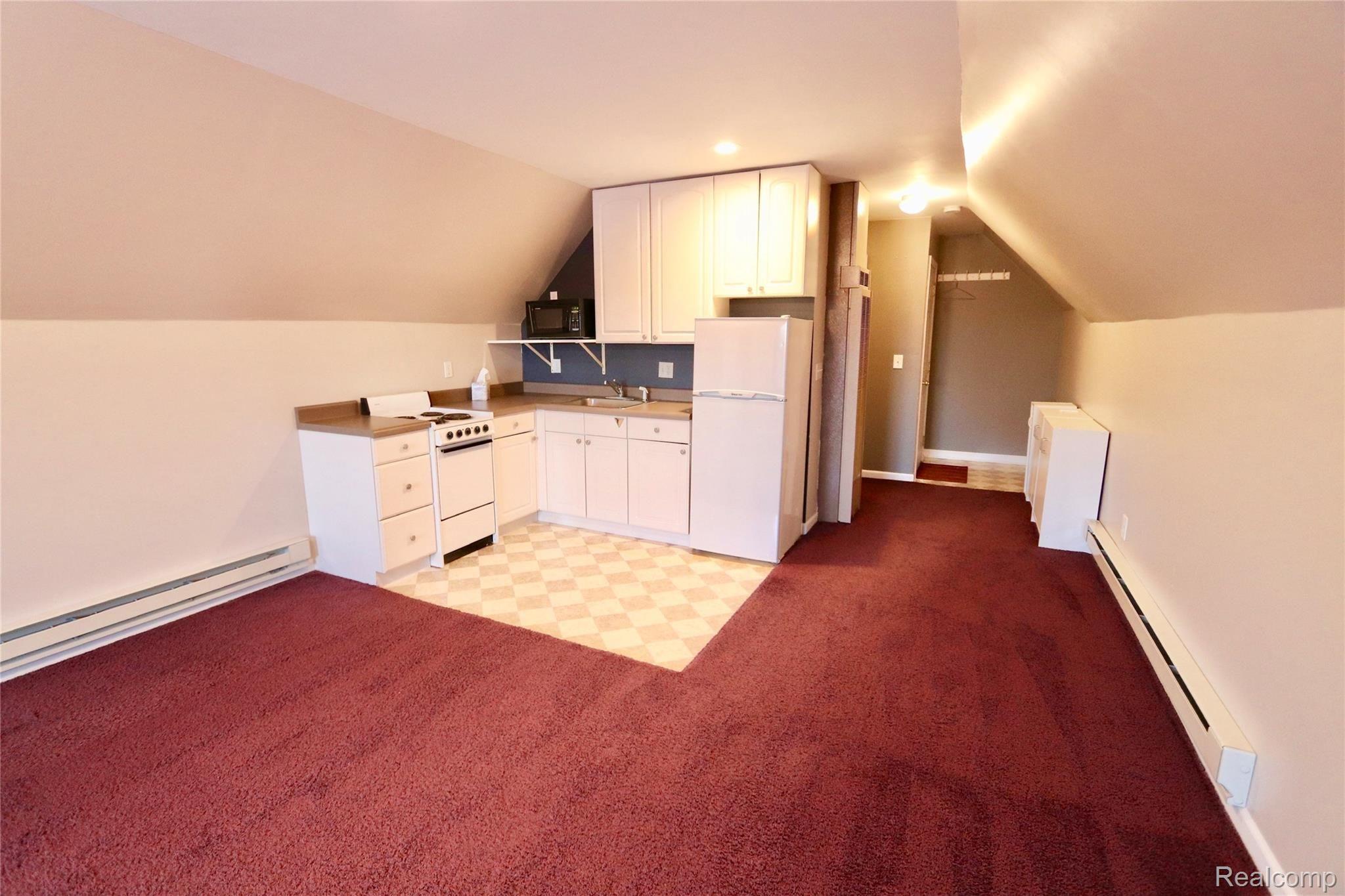 7751 Munsell Road Howell, MI 48843 - Photo 58 of 60 Fully functioning with stove, refrigerator, microwave and sink.