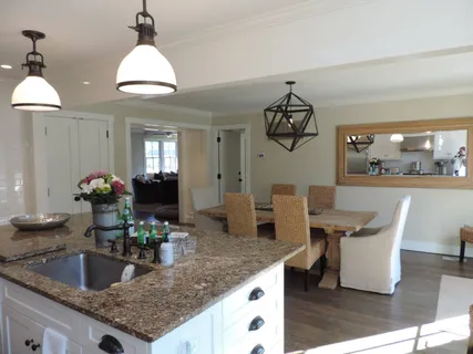 a view of a dining room with furniture and window