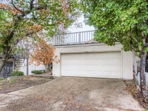 a view of backyard space with large trees