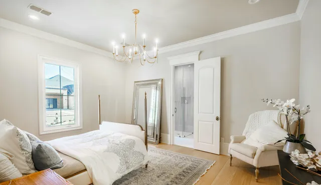 a bedroom with a bed ceiling fan and a window