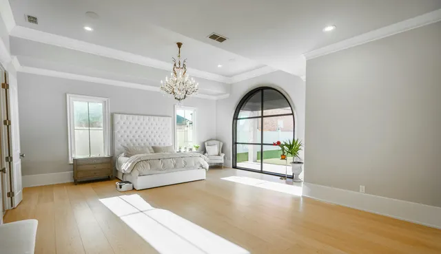 a living room with a balcony furniture and a large window