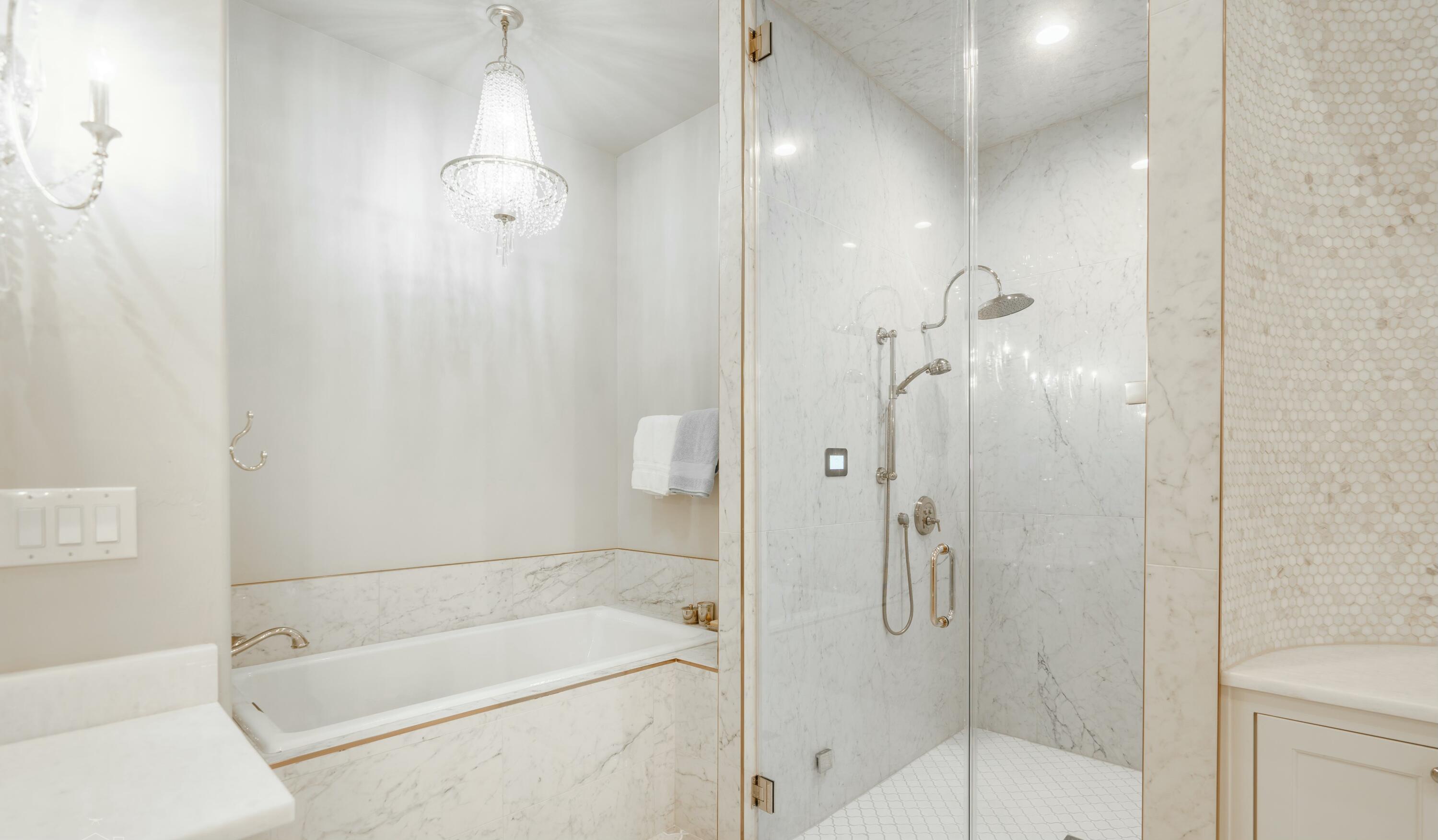 4011 140th Street Lubbock, TX 79423 - Photo 19 of 52 a bathroom with a tub and a shower