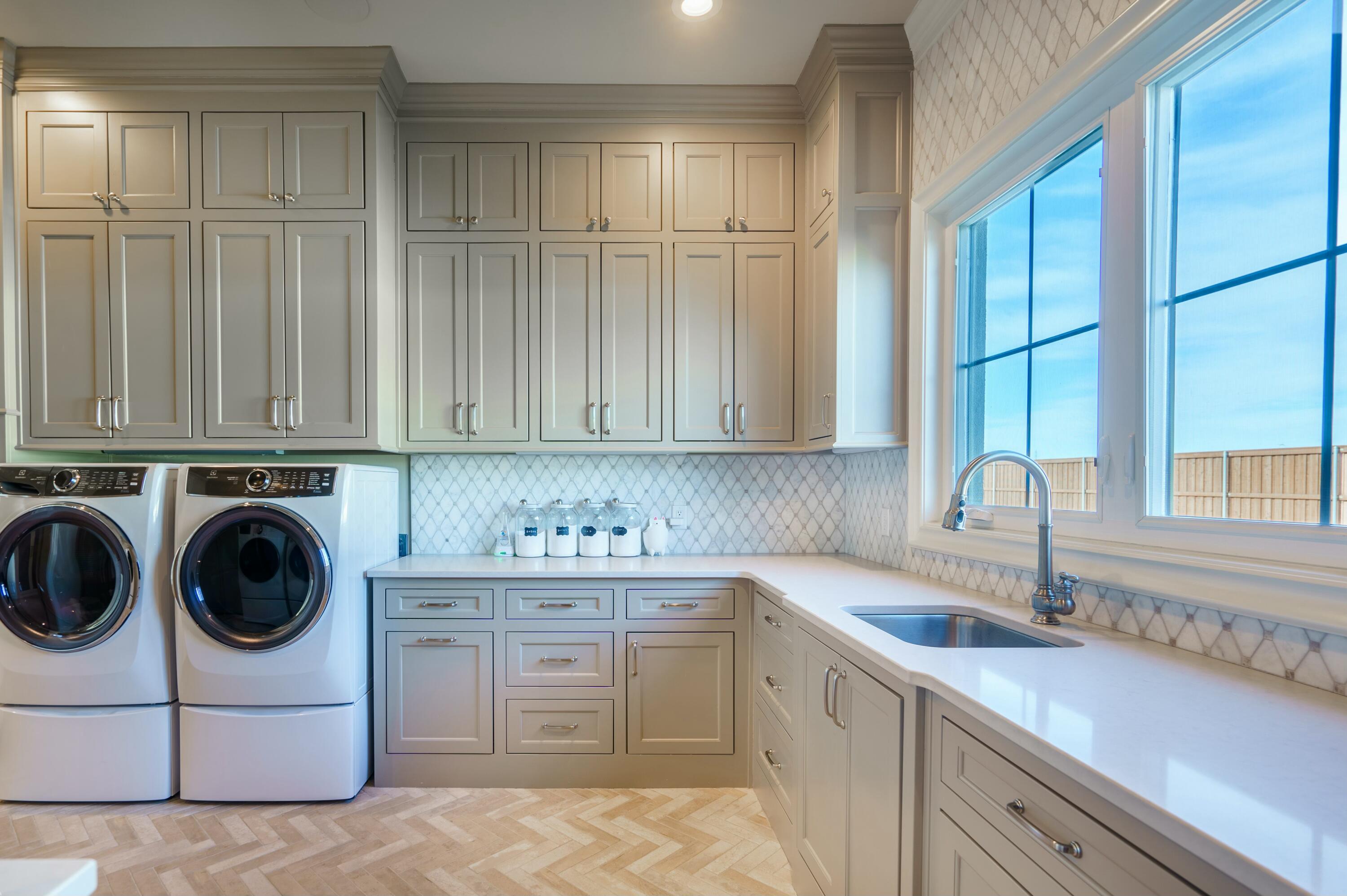 4011 140th Street Lubbock, TX 79423 - Photo 36 of 52 a kitchen with a sink cabinets and a window