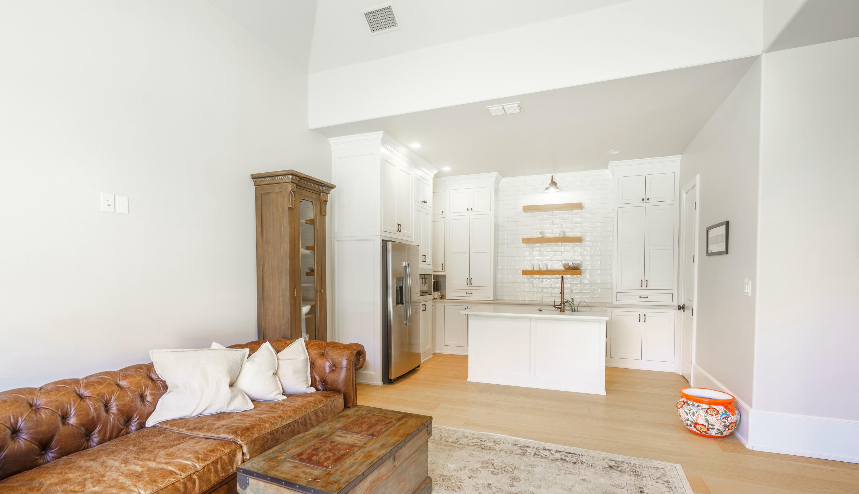4011 140th Street Lubbock, TX 79423 - Photo 44 of 52 a living room with furniture and a chandelier