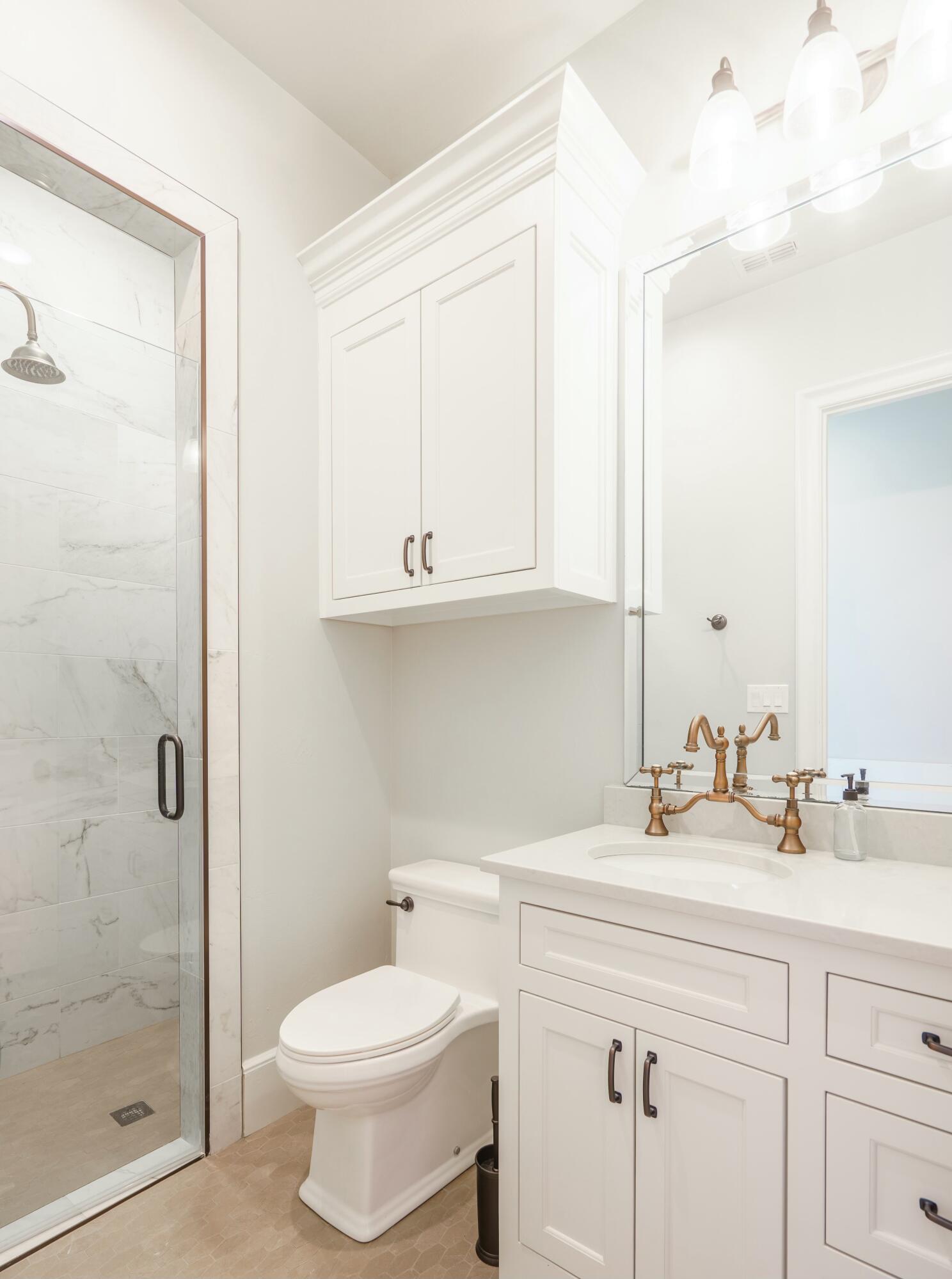 4011 140th Street Lubbock, TX 79423 - Photo 46 of 52 a bathroom with a sink toilet and shower