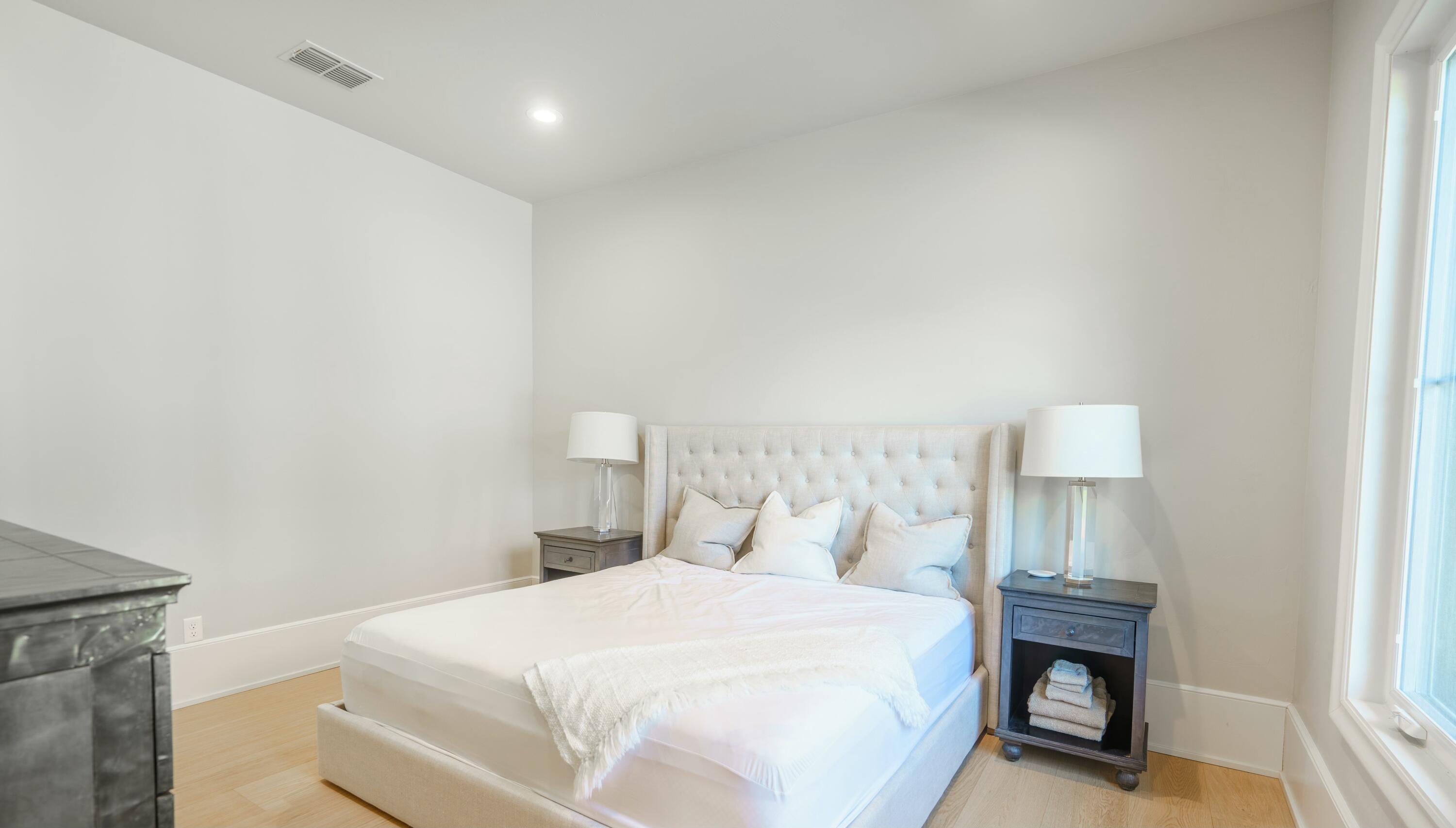 4011 140th Street Lubbock, TX 79423 - Photo 47 of 52 a bedroom with a bed and a lamp