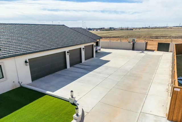 an aerial view of a house with a swimming pool