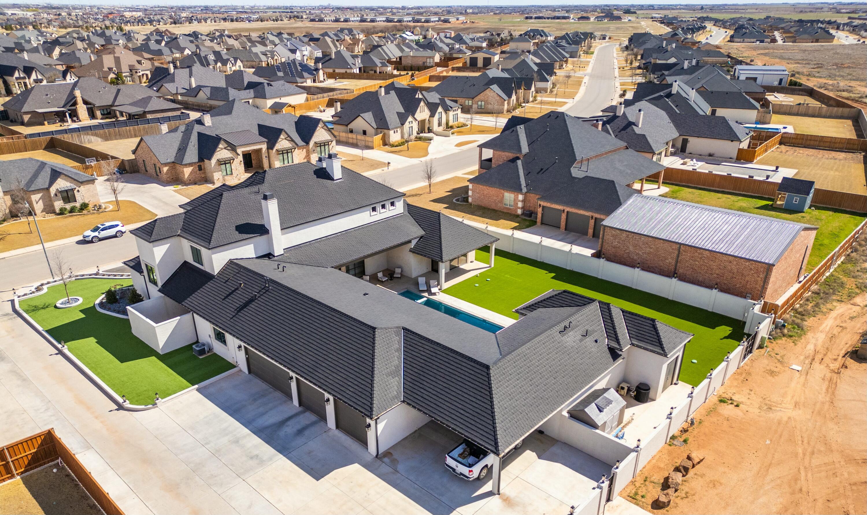 4011 140th Street Lubbock, TX 79423 - Photo 50 of 52 an aerial view of a house with a swimming pool