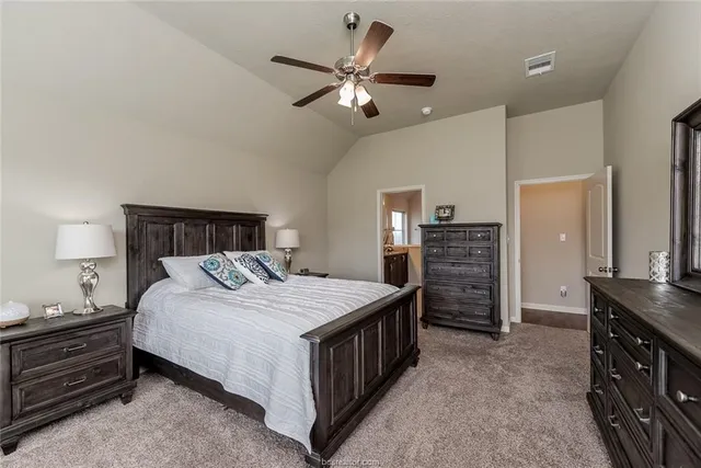 a bedroom with a bed and dresser
