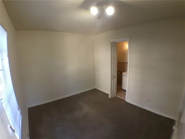 an empty room with a bathroom