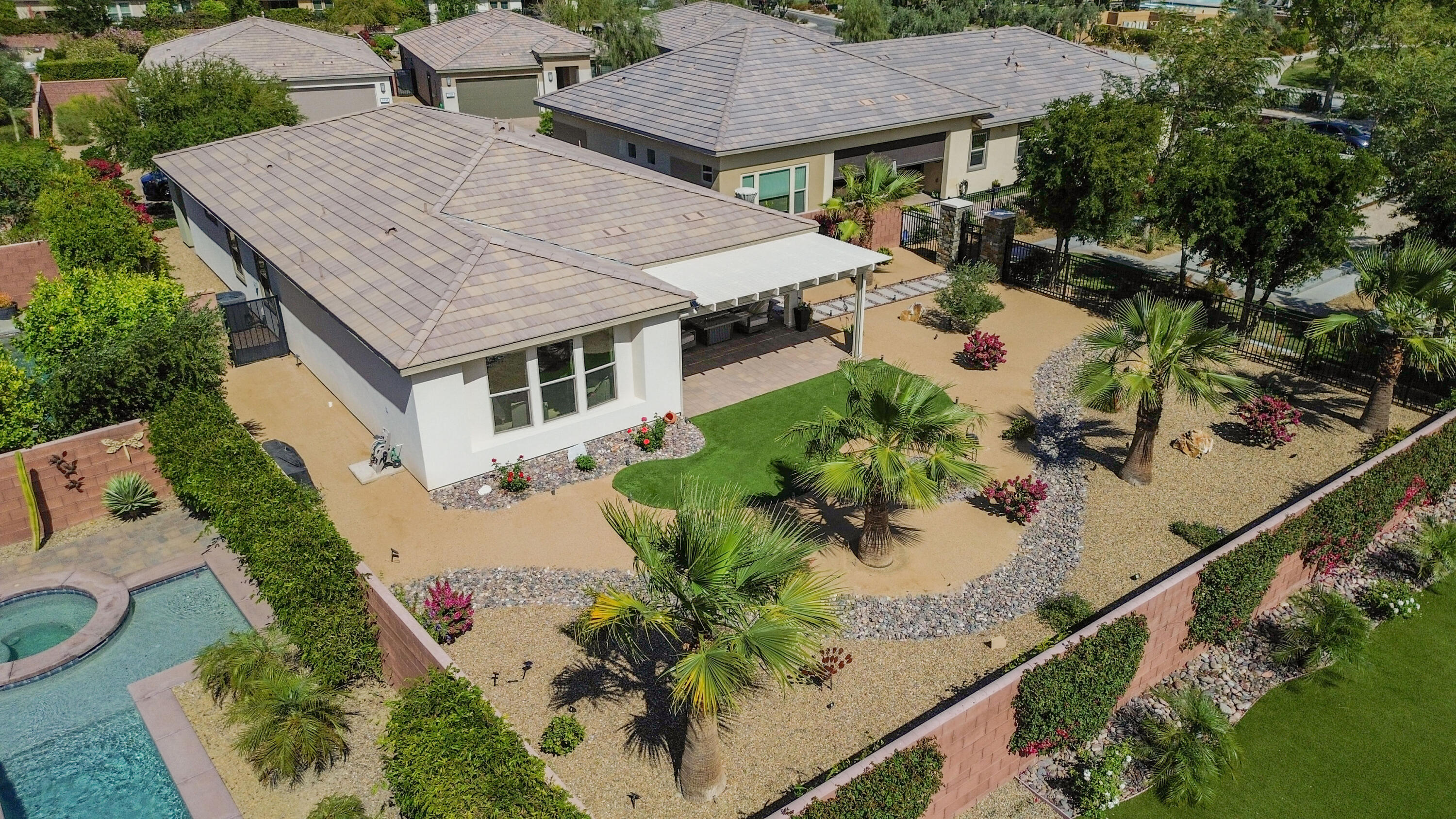 an aerial view of a house with a yard and a garden