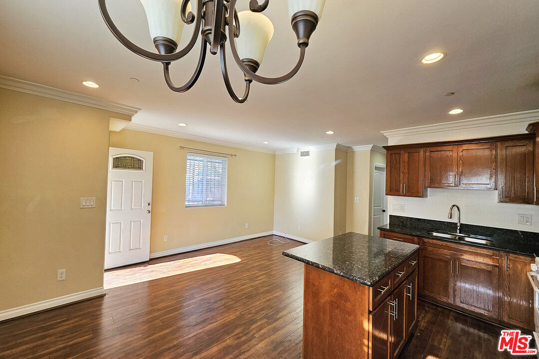 1432 1/2 Ricardo Street Los Angeles, CA 90033 - Photo 6 of 21 a kitchen with stainless steel appliances granite countertop a stove a sink and a microwave