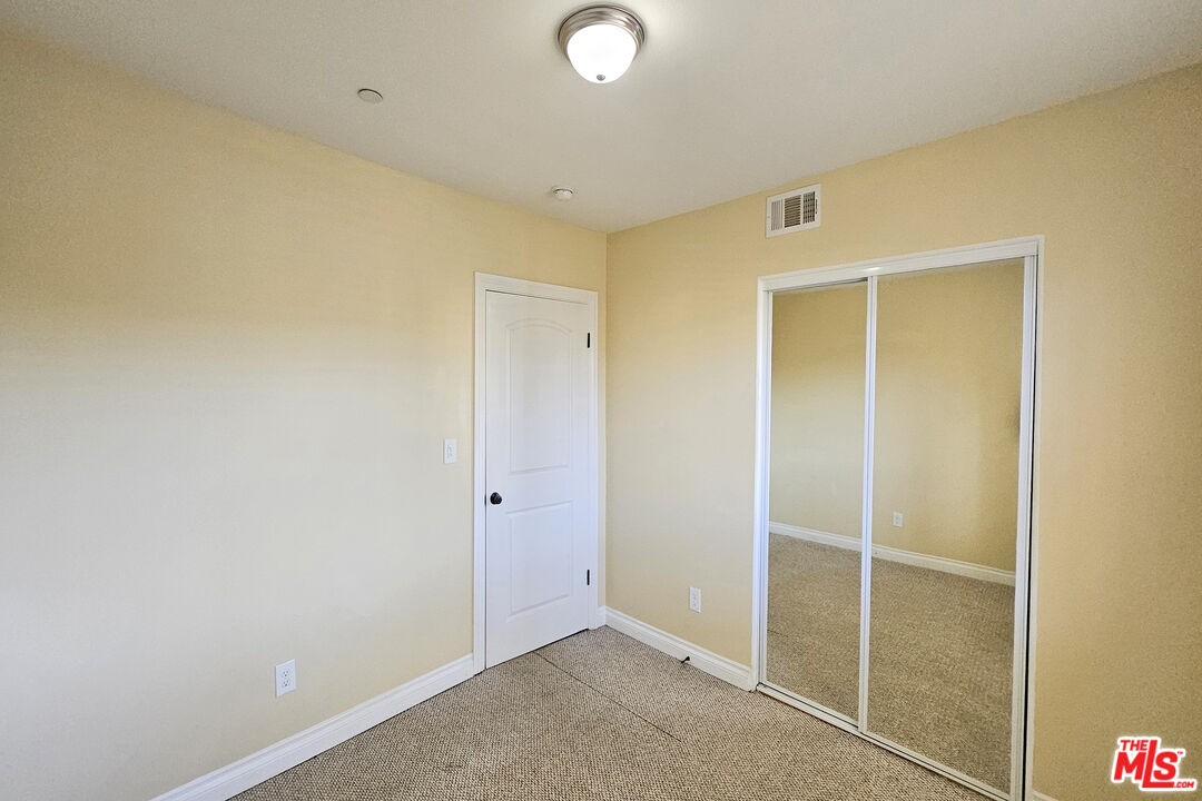 1432 1/2 Ricardo Street Los Angeles, CA 90033 - Photo 8 of 21 an empty room with closet area
