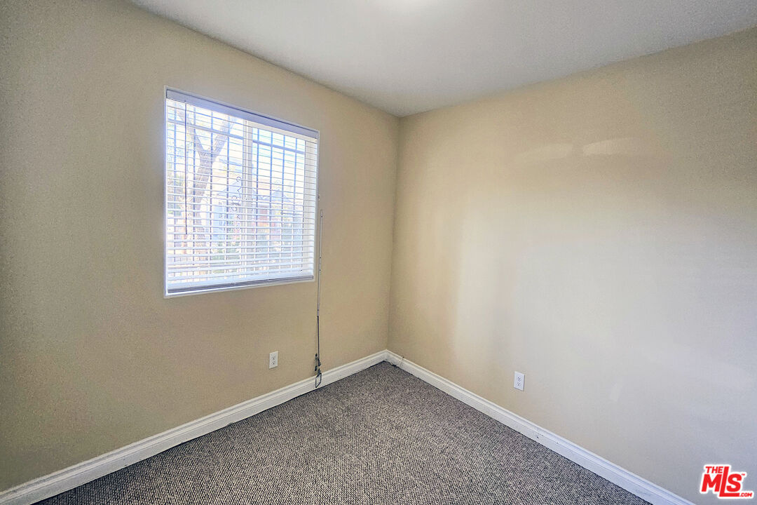 1432 1/2 Ricardo Street Los Angeles, CA 90033 - Photo 9 of 21 an empty room with a window