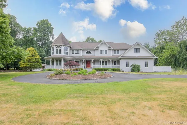 a front view of house with yard and outdoor seating