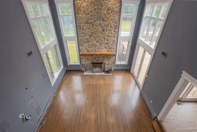 a view of an entryway with wooden floor