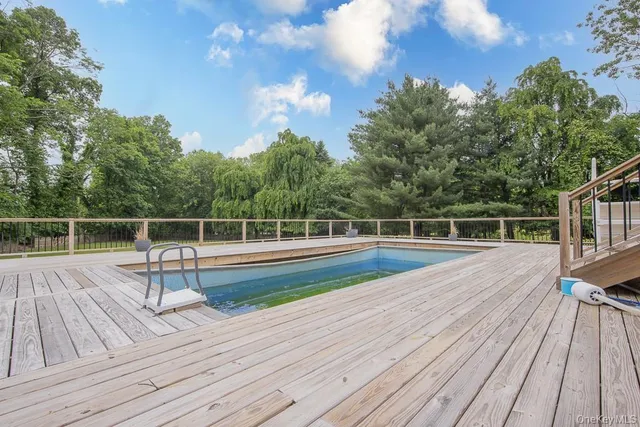 a view of wooden deck having patio