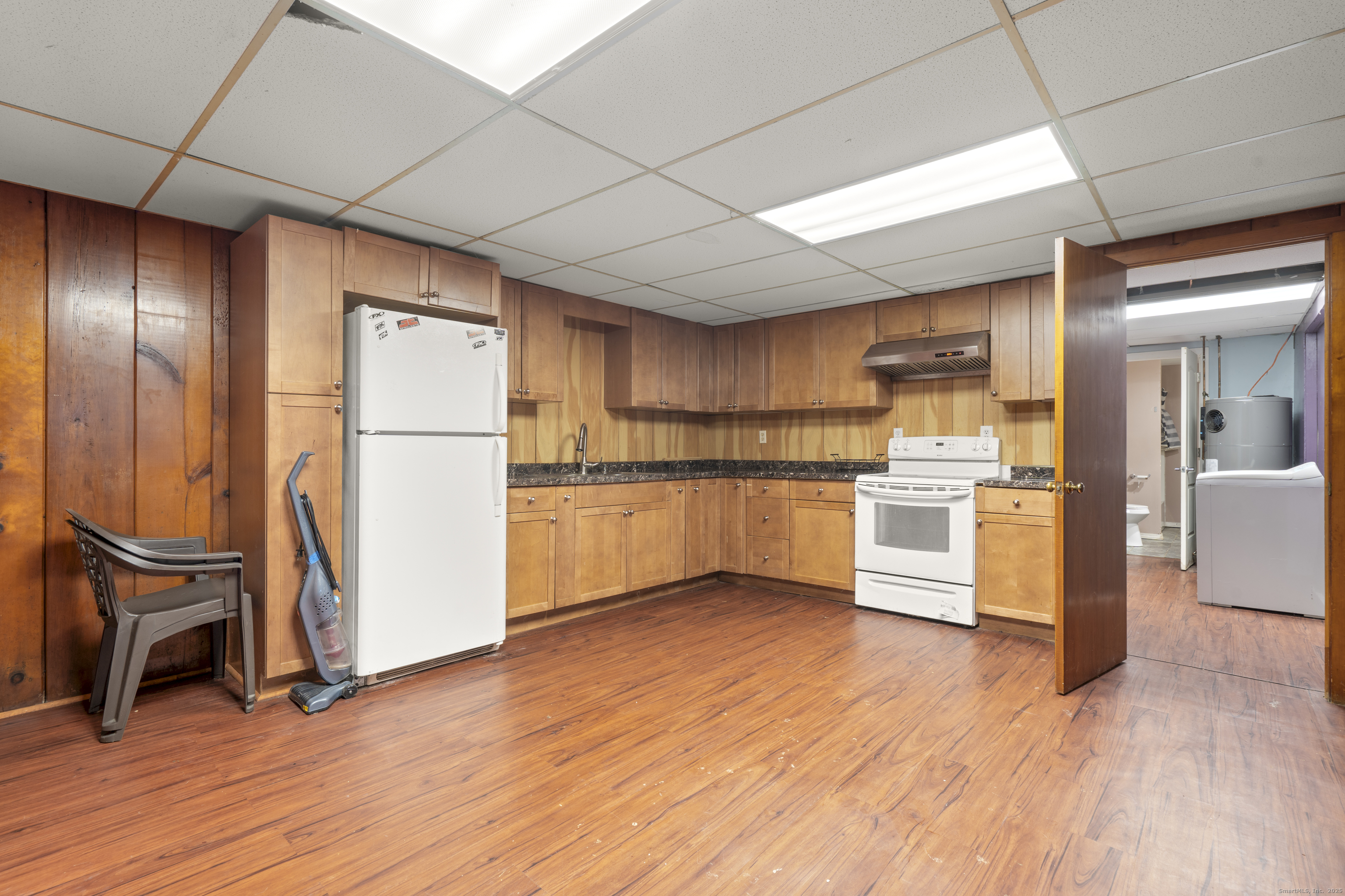523 Chamberlain Hill Road Haddam, CT 06441 - Photo 23 of 38 a kitchen with granite countertop wooden floors and stainless steel appliances