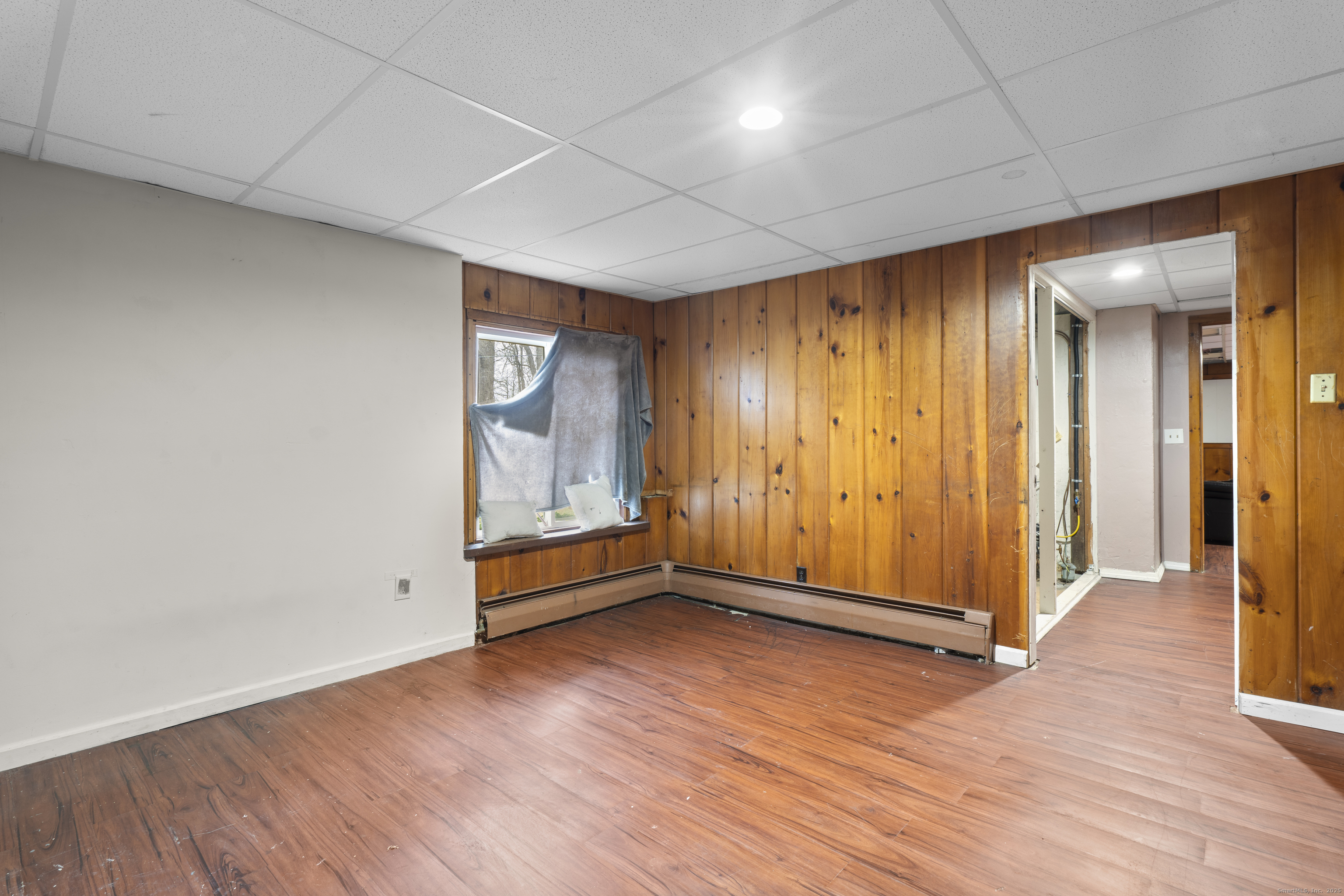 523 Chamberlain Hill Road Haddam, CT 06441 - Photo 27 of 38 an empty room with wooden floor and windows
