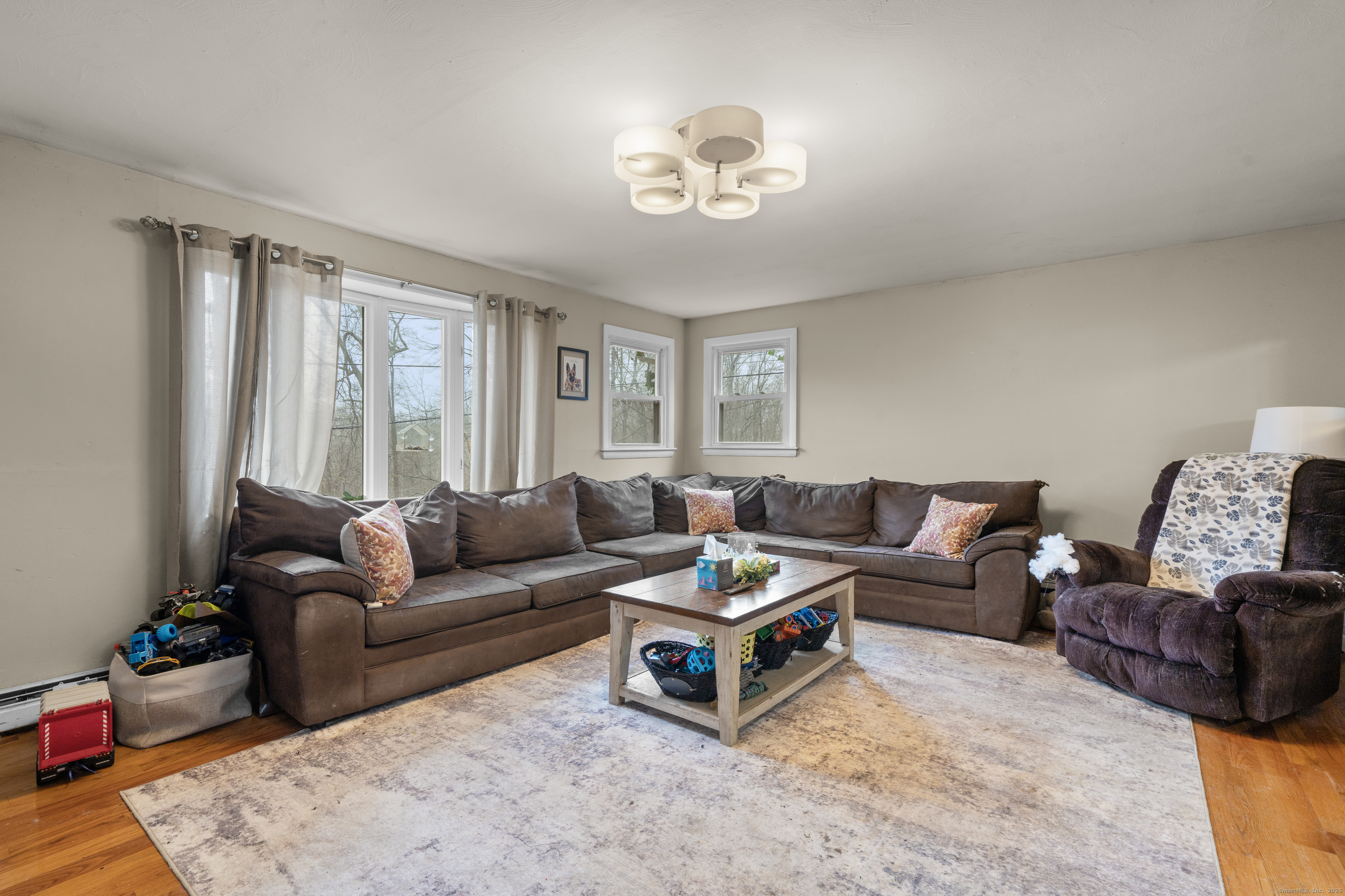 523 Chamberlain Hill Road Haddam, CT 06441 - Photo 28 of 38 a living room with furniture and a large window